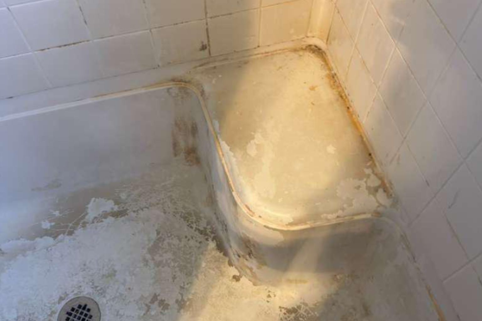 Severely neglected bathroom grout before deep cleaning King of Prussia home